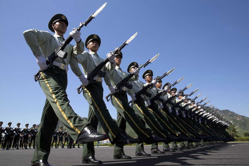 Chinese troops practice marching ahead of a Sept. 3 military parade at a camp on the outskirts of Beijing, Saturday, Aug. 22, 2015. China is ramping up publicity for its upcoming World War II military parade that will feature 12,000 soldiers and 500 pieces of military equipment, but officials still aren't saying which other countries are taking part in the spectacle. (AP Photo/Ng Han Guan) Chinese troops practice marching ahead of a Sept. 3 military parade at a camp on the outskirts of Beijing, Saturday, Aug. 22, 2015. China is ramping up publicity for its upcoming World War II military parade that will feature 12,000 soldiers and 500 pieces of military equipment, but officials still aren't saying which other countries are taking part in the spectacle. (AP Photo/Ng Han Guan)